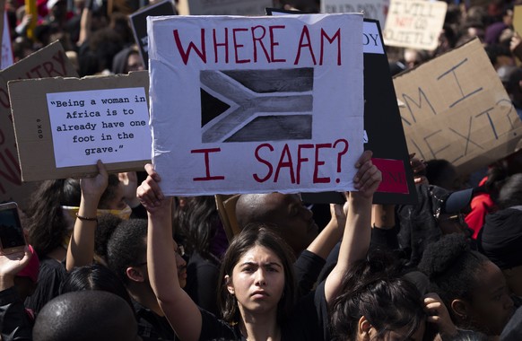 epa07819537 Tens of thousands protest outside parliament against gender based violence following a week of brutal murders of young South African women in Cape Town, South Africa, 05 September 2019. Th ...
