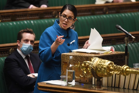 epa09602702 A handout photograph released by the UK Parliament shows British Home Secretary Priti Patel speaking on the small boats incident in the Channel, in the House of Commons in Westminster, Lon ...