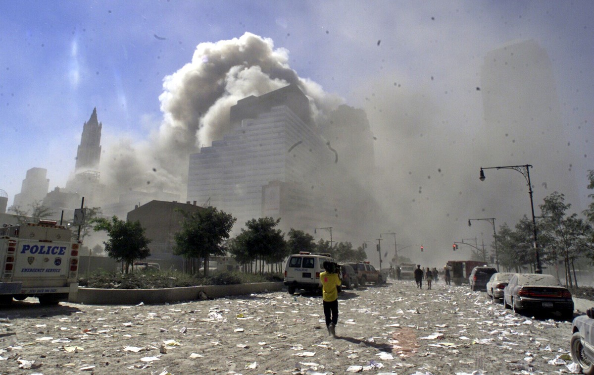 FILE - A street in New York's lower Manhattan area is littered with debris after the collapse of the twin towers of the World Trade Center following terrorist attacks, Sept. 11, 2001. (AP Photo/R ...