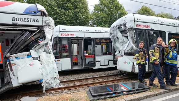 Emergency responders work at the scene of an accident where two trams collided in Gelsenkirchen, Germany, Thursday, Aug. 6, 2026. (AP Photo/Martin Meissner)
Germany Tram Crash