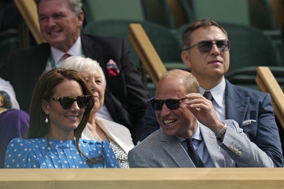 Britain&#039;s Prince William and Kate, Duchess of Cambridge smile as they sit in the Royal box on Centre Court as they watch the men&#039;s singles quarterfinal match between Serbia&#039;s Novak Djok ...