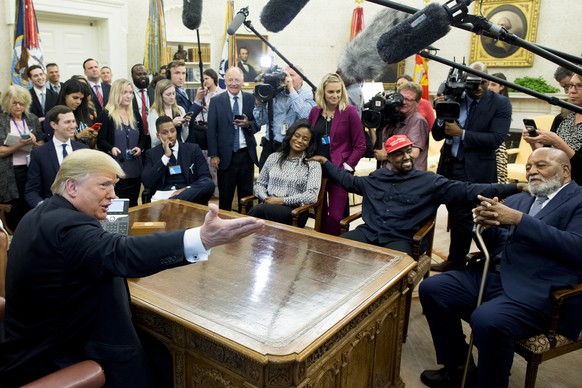 epa07086406 US President Donald J. Trump (Front L) meets with US rapper and producer Kanye West (2-R) and retired football player Jim Brown (R) in the Oval Office of the White House in Washington, DC, ...