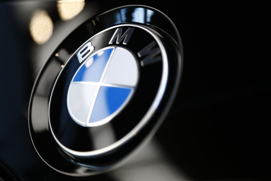 FILE- The logo of BMW is shown on a BMW car on March 20, 2019 in Munich, Germany. BMW is recalling more than 917,000 cars and SUVs in the U.S., Wednesday, March 9, 2022, most for a third time _ to fix ...