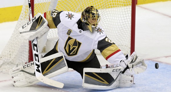 Vegas Golden Knights goalie Marc-Andre Fleury blocks a shot during the first period of an NHL hockey game against the Dallas Stars in Dallas, Friday, Oct. 6, 2017. (AP Photo/LM Otero)