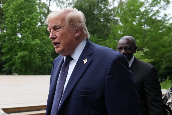 U.S. President Donald Trump walks away after a group photo of leaders at the G7 summit, Tuesday, June 16, 2026, in Evian-les-Bains, France. (AP Photo/Julia Demaree Nikhinson)
France G7 Summit Trump