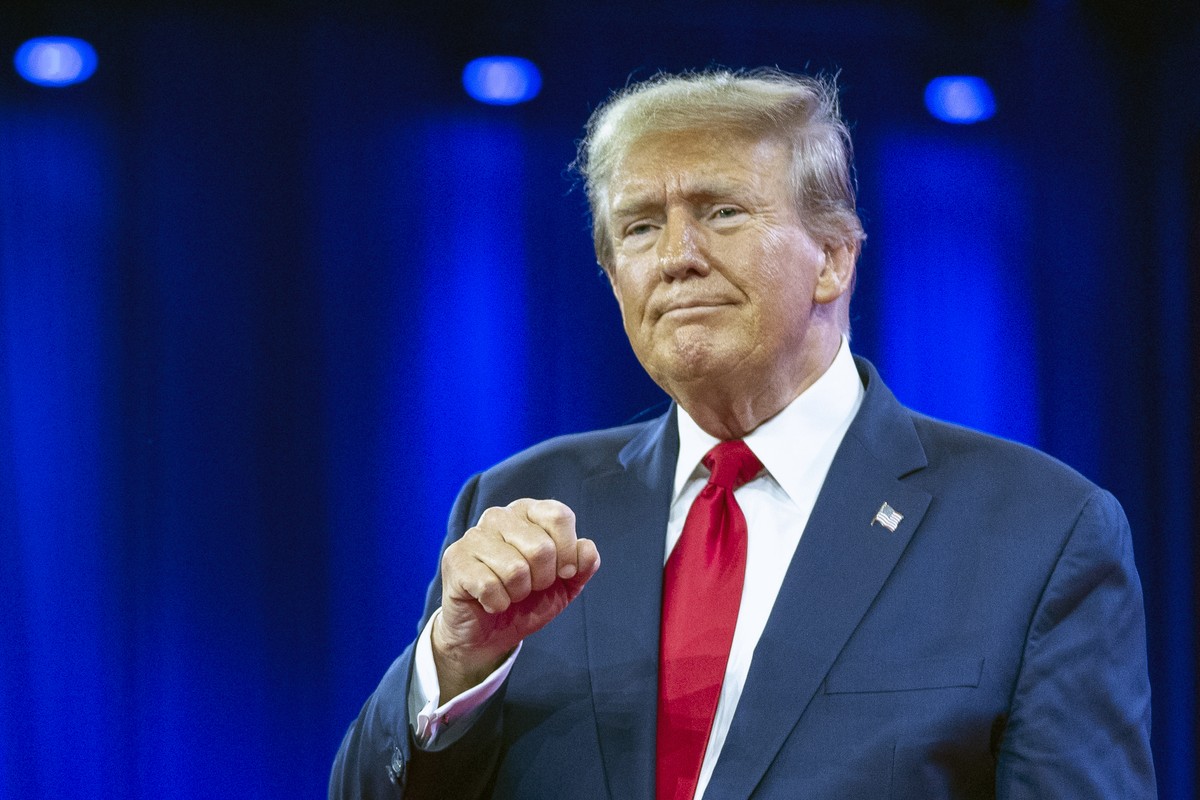 FILE - Republican presidential candidate former President Donald Trump pumps his fist as he departs after speaking during the Conservative Political Action Conference, CPAC 2024, at National Harbor, i ...