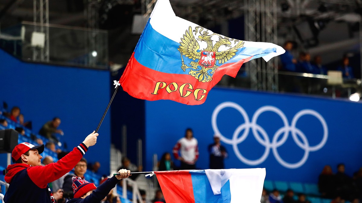 epa09792091 (FILE) - Russian fans wave flags during the men's preliminary round ice hockey match between Russia and the USA inside the Gangneung Hockey Centre at the PyeongChang Winter Olympic Ga ...