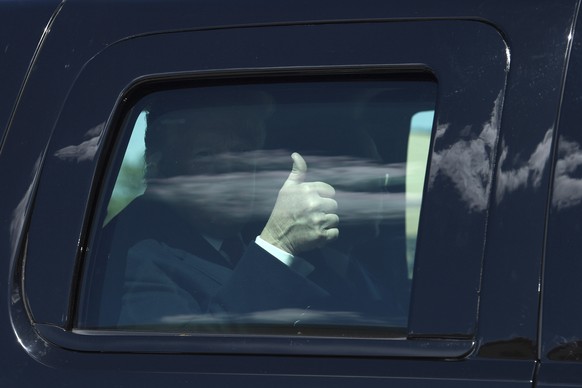 President Donald Trump gives thumbs up as his motorcade arrives at Air Force One at Andrews Air Force Base , Md., Monday, April 15, 2019. Trump is heading to Minnesota to tout the 2017 tax law. (AP Ph ...