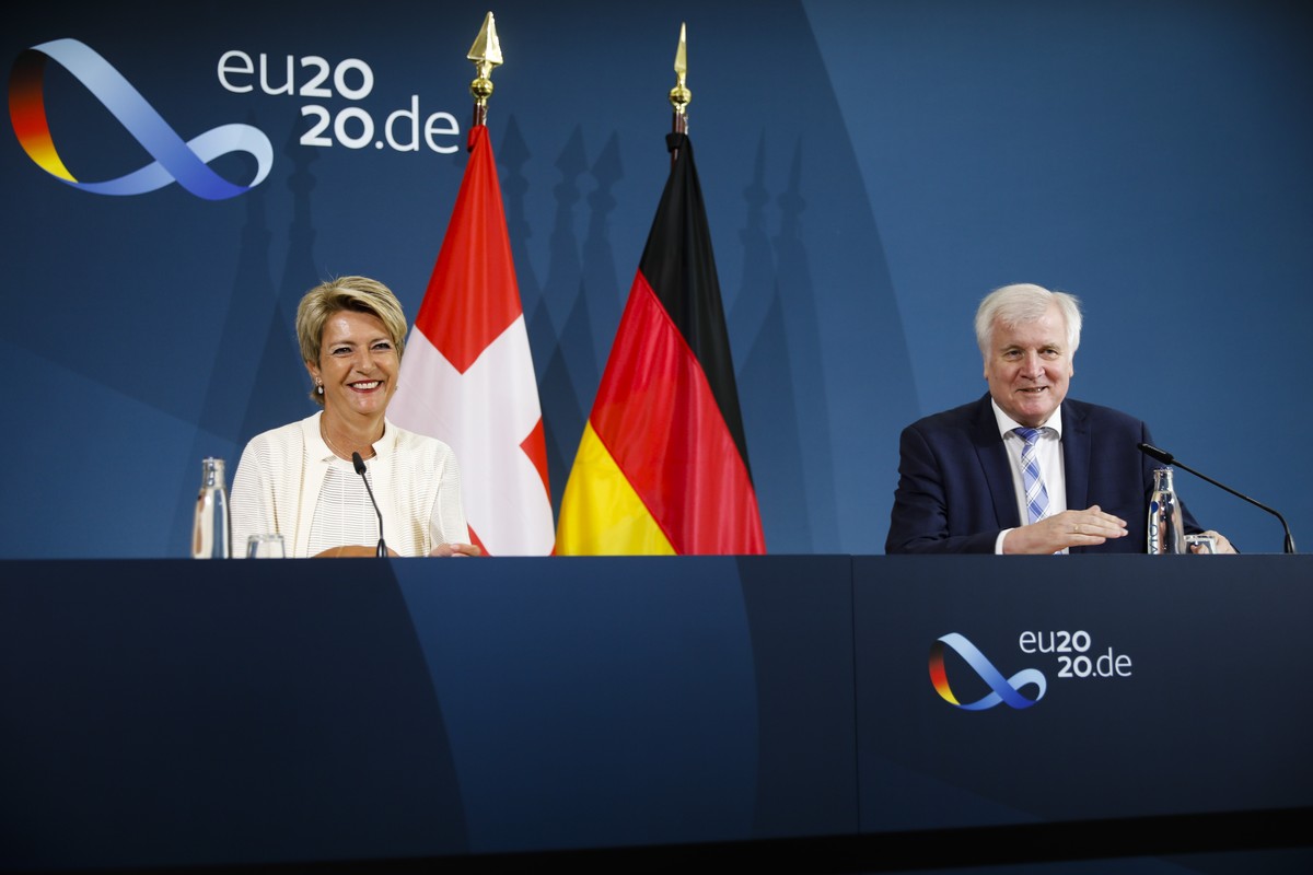German Interior Minister Horst Seehofer, right, and Switzerland's Justice Minister Karin Keller-Sutter brief the media after a meeting at the Interior Ministry in Berlin, Germany, Tuesday, July 2 ...