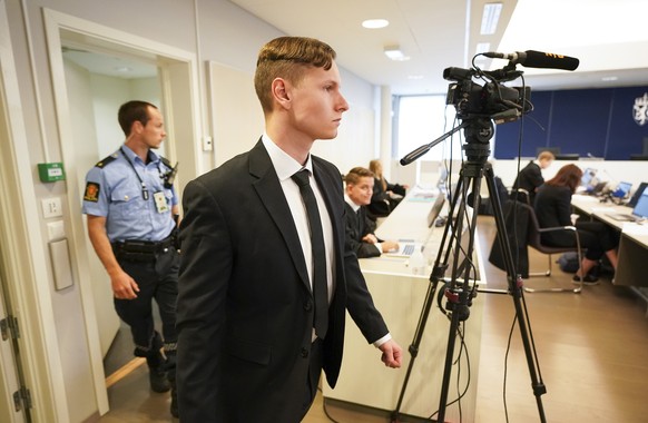 epa08406776 Norwegian suspect Philip Manshaus arrives for the start of his trial on terrorism and murder charges in the Asker and Baerum district court in Sandvika, west of Oslo, Norway, 07 May 2020.  ...