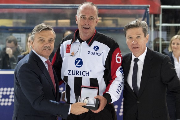 Rene Fasel, President of the International Ice Hockey Federation, IIHF, left, Danny Kurmann, referee, center, and Viatcheslav Arkadievitch &quot;Slava&quot; Bykov, former Russian ice hockey player, ta ...