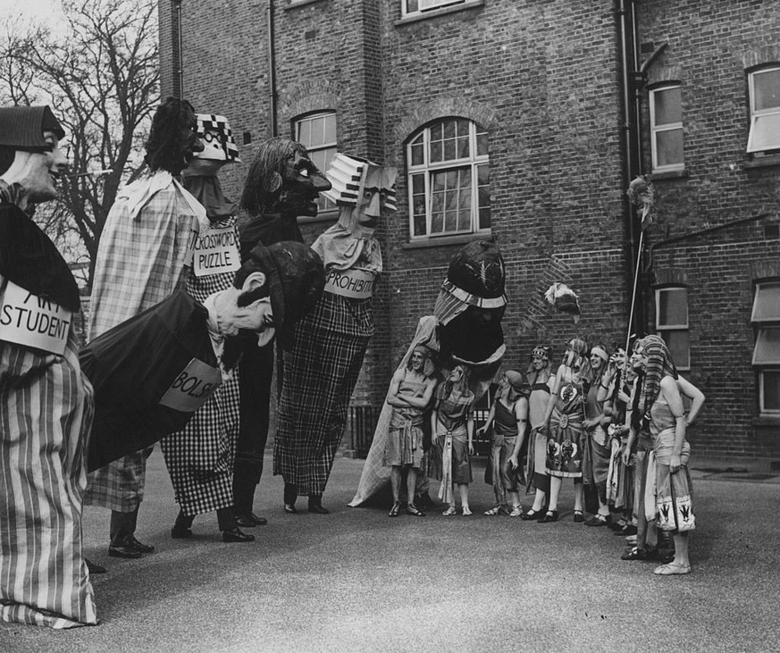 26th February 1926: Party goers in fancy dress at the Chelsea Arts Ball in London. (Photo by E. Bacon/Topical Press Agency/Getty Images)