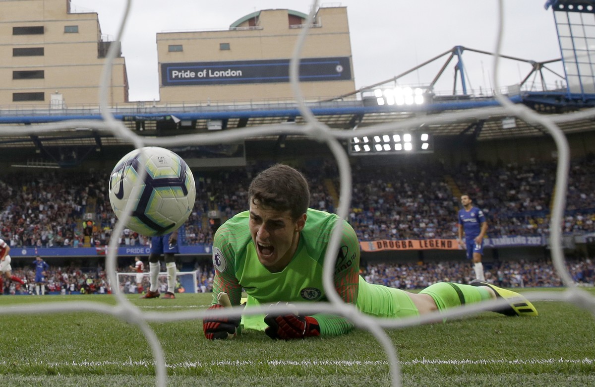 Chelsea goalkeeper Kepa Arrizabalaga reacts after failing to stop the goal scored by Arsenal's Alex Iwobi during the English Premier League soccer match between Chelsea and Arsenal at Stamford br ...