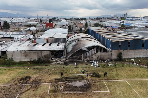 Rescue workers inspect the site of a plane crash near Toluca airport in San Mateo Atenco, Monday, Dec. 15, 2025. (AP Photo/Ramses Mercado)
Mexico Plane Crash