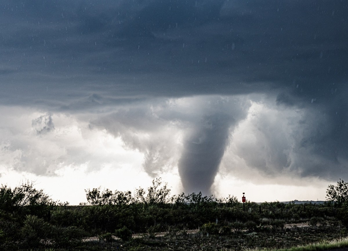 A huge dark cloud with a swirling funnel in southwest Texas 23622718 RECORD DATE NOT STATED