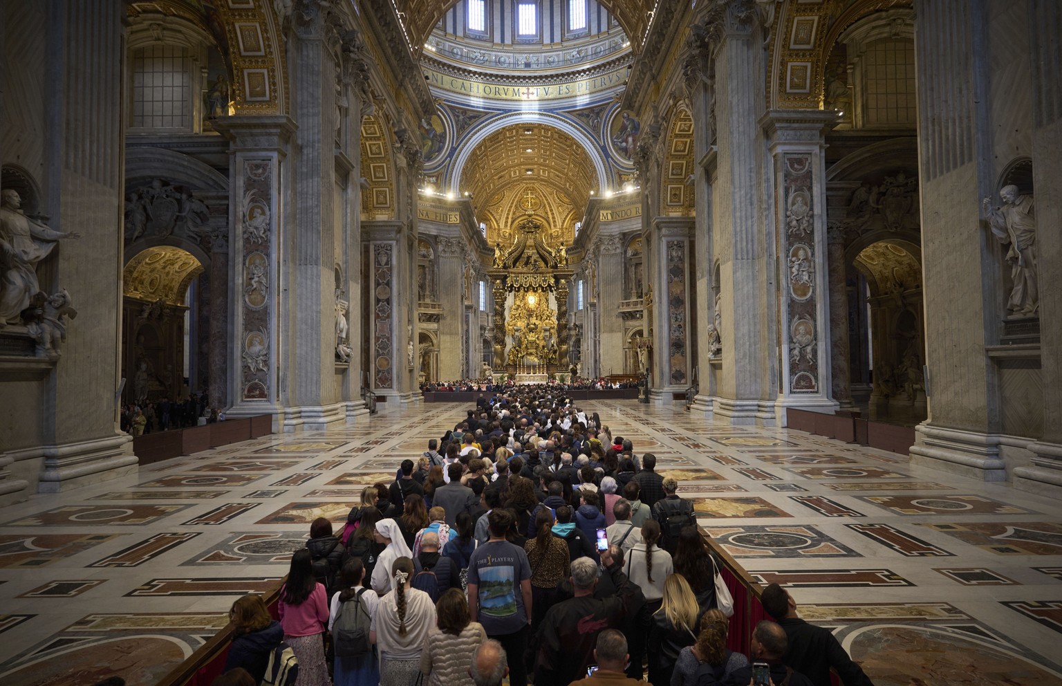 People line up as they enter St. Peter&#039;s Basilica to pay their respects to Pope Francis lying in state, at the Vatican, Thursday, April 24, 2025. (AP Photo/Emilio Morenatti)
APTOPIX Vatican Pope