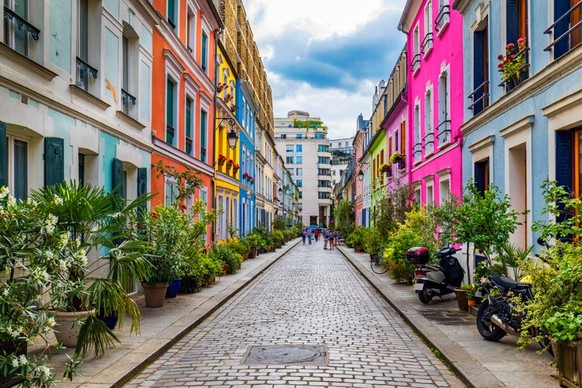 Cremieux Street (Rue Cremieux), Paris, France.  Rue Cremieux in the 12th arrondissement is one of the most beautiful residential streets in Paris.  Colored houses on Rue Cremieux street in Paris.  France.
