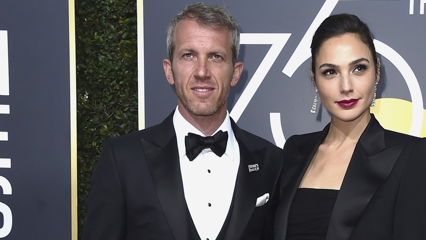 Gal Gadot, right, and Yaron Versano arrive at the 75th annual Golden Globe Awards at the Beverly Hilton Hotel on Sunday, Jan. 7, 2018, in Beverly Hills, Calif. (Photo by Jordan Strauss/Invision/AP)