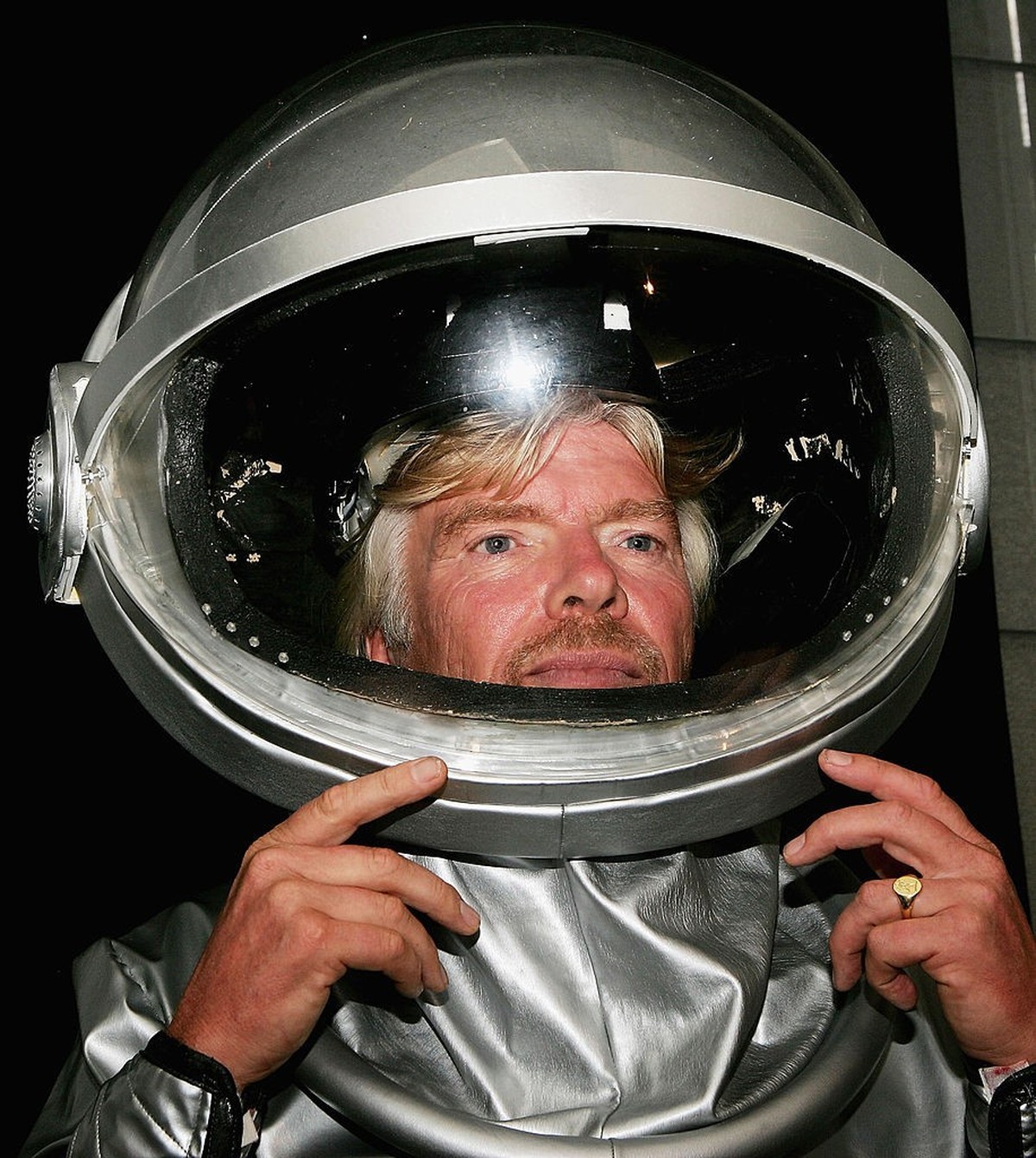 SYDNEY, NSW - DECEMBER 13: Sir Richard Branson poses for a photograph during Australia's first private sign up to become an astronaut at The Establishment Hotel on December 13, 2005 in Sydney, Au ...