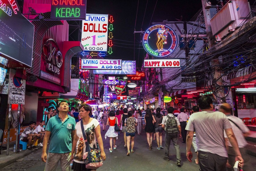 Sept. 25, 2014 - Pattaya, Chonburi, Thailand - Tourists on Walking Street, the red light district in Pataya. Pataya, a beach resort about two hours from Bangkok, has wrestled with a reputation of havi ...