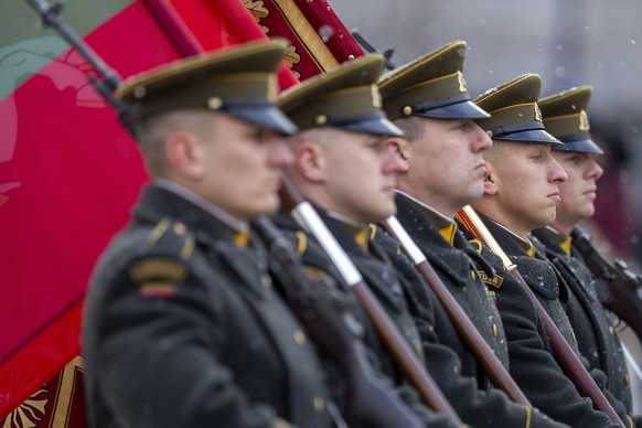 CORRECTS NATIONALITY TO LITHUANIAN - Members of the Lithuanian Army attend a ceremony marking the 106th anniversary of the Lithuanian military, on Armed Forces Day in Vilnius, Lithuania, Saturday, Nov ...