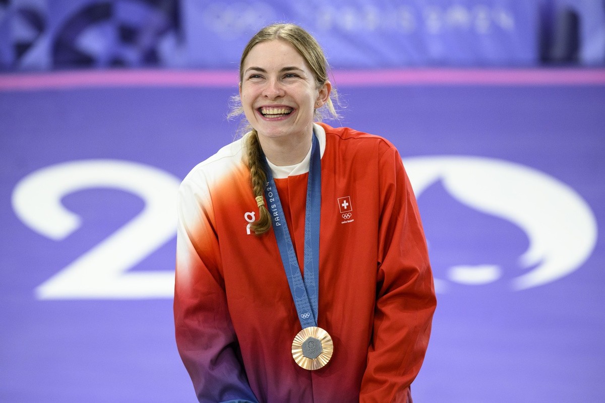 Bronze medalist Zoe Claessens of Switzerland celebrates with her medal during the medal ceremony after the women's cycling BMX final race at the 2024 Paris Summer Olympics in Paris, France, Frida ...
