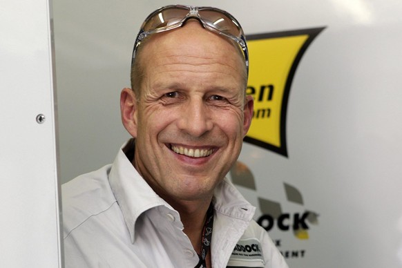 Swiss Daniel Epp, owner of Swiss Moto2 motorcycle pilot Thomas Luethi&#039;s Interwetten-Paddock team, smiles in his team box, after the second free practice to Sunday&#039;s Grand Prix de France, in  ...