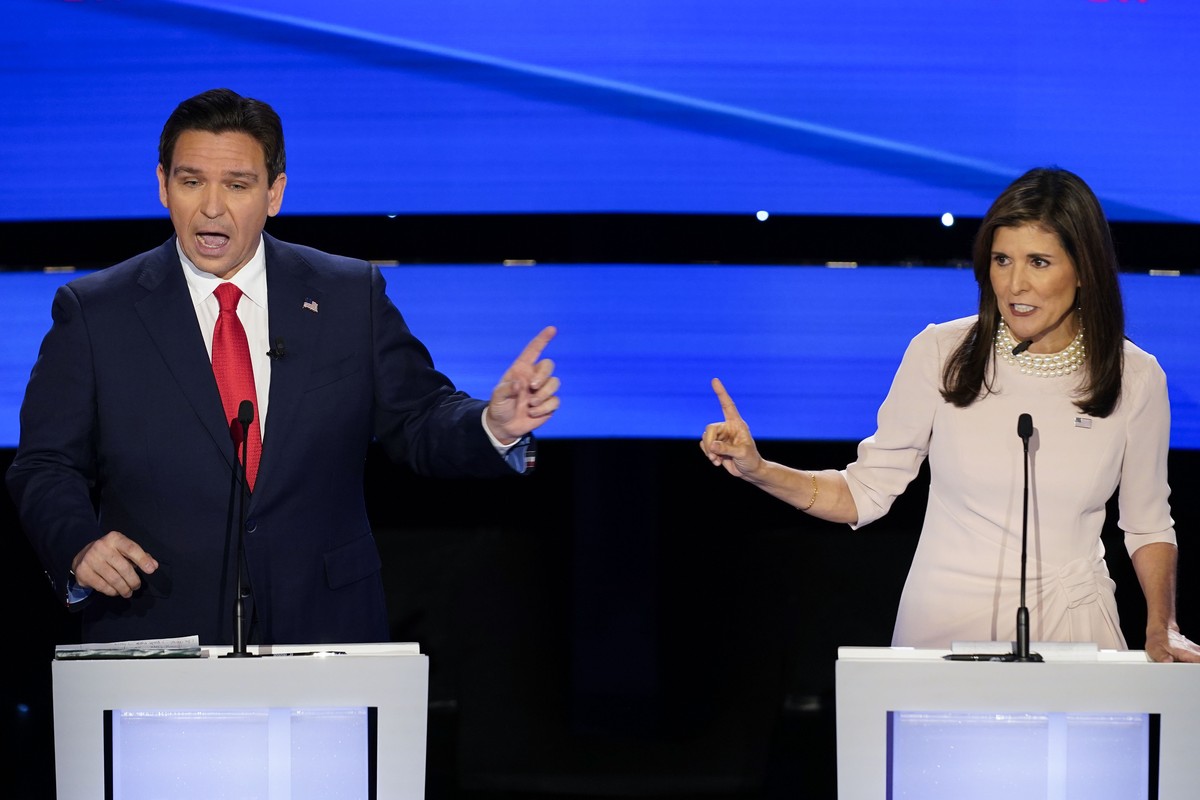 Former UN Ambassador Nikki Haley, right, and Florida Gov. Ron DeSantis, left, both speaking at the at the CNN Republican presidential debate at Drake University in Des Moines, Iowa, Wednesday, Jan. 10 ...