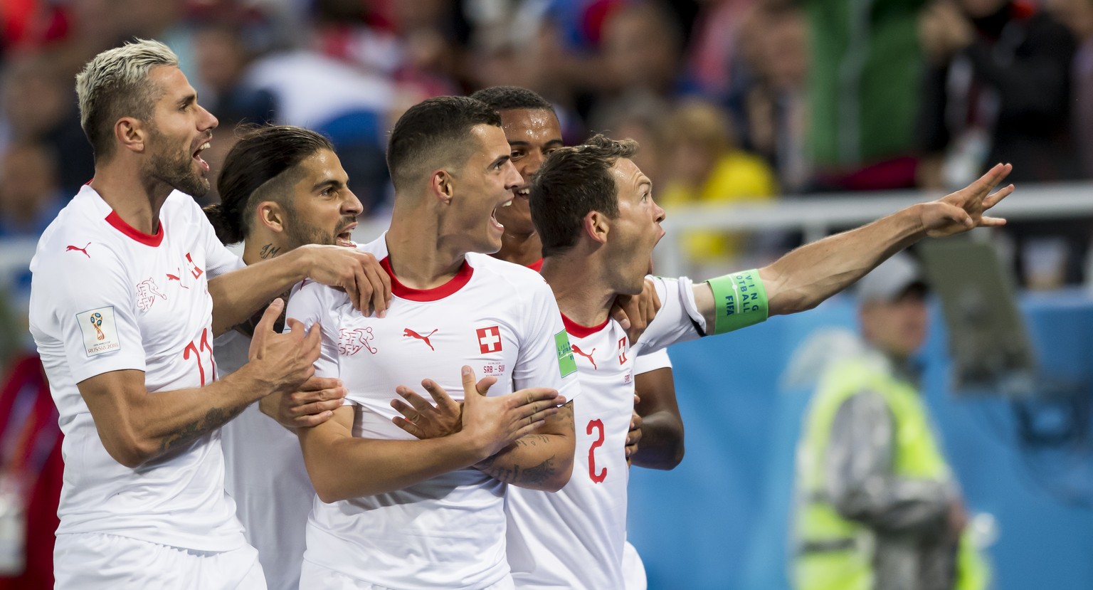 Switzerland&#039;s midfielder Granit Xhaka, center, celebrates after scoring a goal with team mates Switzerland&#039;s midfielder Valon Behrami, Switzerland&#039;s defender Ricardo Rodriguez, Switzerl ...