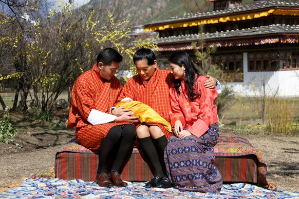 In this Tuesday, Feb. 9, 2016 photo released by the Royal Office for Media of the Kingdom of Bhutan, Bhutanese King Jigme Khesar Namgyel Wangchuck, left, his father and the fourth King of Bhutan Jigme ...