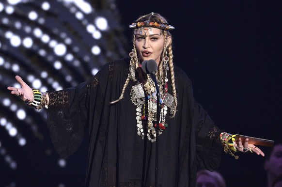 FILE - Madonna presents a tribute to Aretha Franklin at the MTV Video Music Awards on Aug. 20, 2018, at Radio City Music Hall in New York. The singer turns 65 on Aug. 16. (Photo by Chris Pizzello/Invi ...