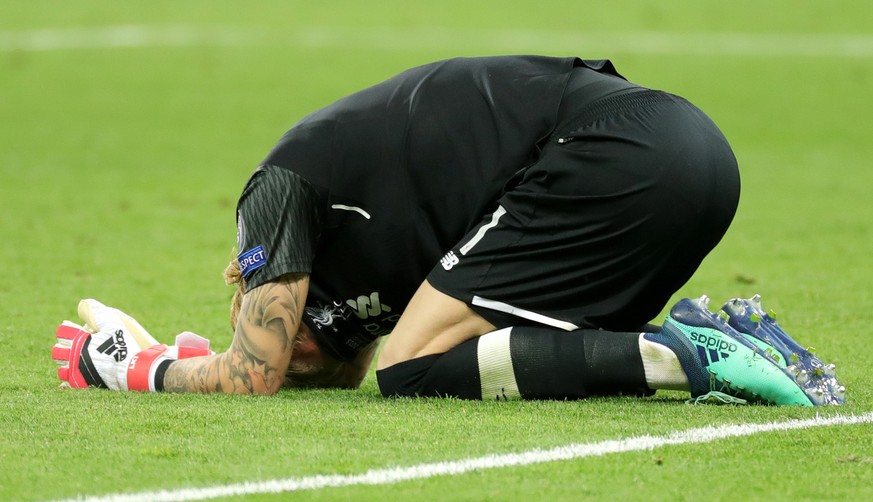 epa06765900 Goalkeeper Loris Karius of Liverpool reacts after the UEFA Champions League final between Real Madrid and Liverpool FC at the NSC Olimpiyskiy stadium in Kiev, Ukraine, 26 May 2018. Madrid  ...