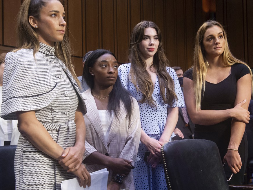 United States gymnasts from left, Aly Raisman, Simone Biles, McKayla Maroney and Maggie Nichols, leave after testifying at a Senate Judiciary hearing about the Inspector General&#039;s report on the F ...