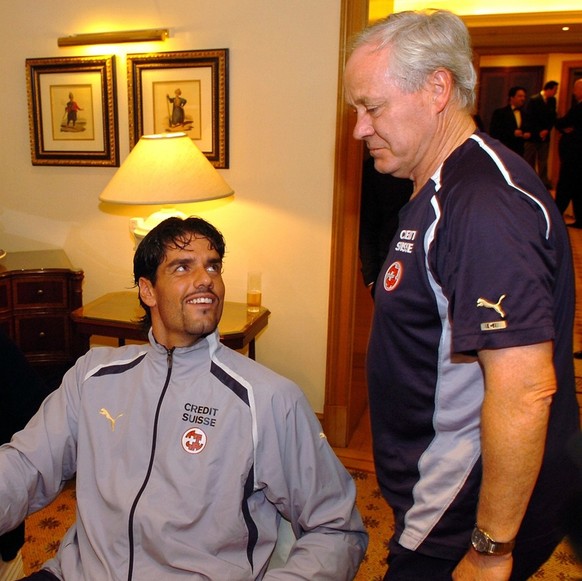 Swiss national team soccer coach Jakob Koebi Kuhn, right, speaks with Swiss national team soccer goalkeeper Pascal Zuberbuehler, center, and player Murat Yakin, left, at they hotel after the FIFA 2006 ...