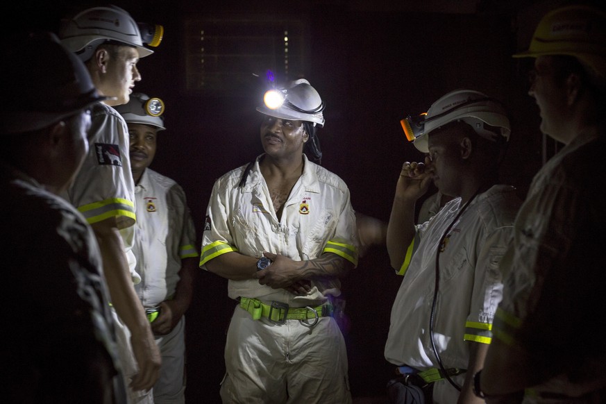 In this Feb. 1, 2018 photo, rescue workers prepare to rescue more than 900 miners from the Sibanye-Stillwater&#039;s Beatrix mine near Welkom, South Africa. The miners were brought to the surface Frid ...