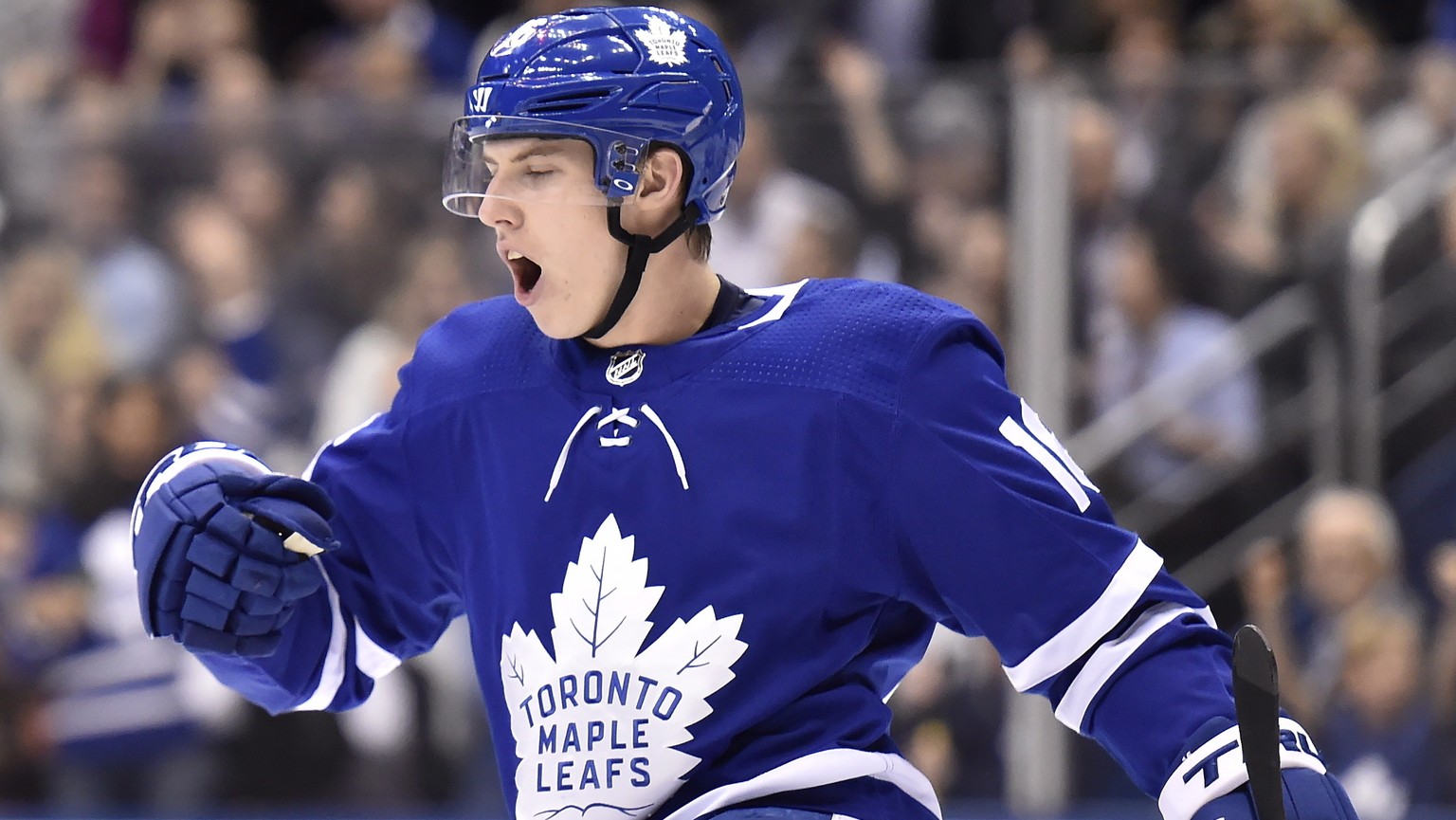 FILE - In this Jan. 31, 2018, file photo, Toronto Maple Leafs center Mitch Marner (16) celebrates his goal against the New York Islanders during the second period of an NHL hockey game in Toronto. Mit ...