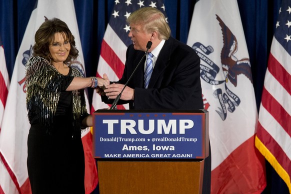 FILE - Former Alaska Gov. Sarah Palin, left, endorses Republican presidential candidate Donald Trump during a rally at the Iowa State University on Jan. 19, 2016, in Ames, Iowa. Republican Palin re-em ...