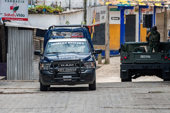 epa11410284 Members of the police and Mexican army patrol in the Tila community, Yajalon municipality, in Chiapas, Mexico, 13 June 2024 (issued 14 June 2024). One week after an exodus of about 4,000 i ...