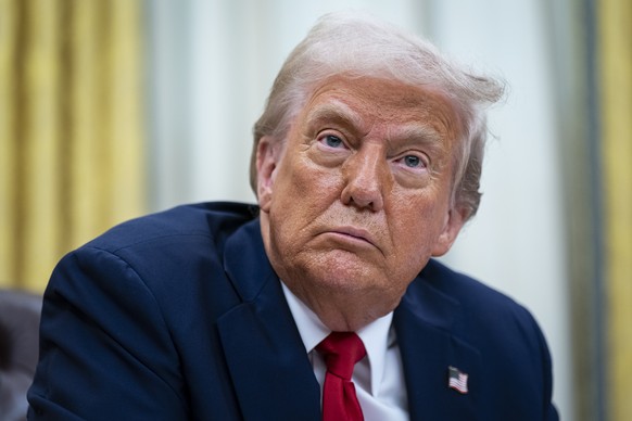 epa12002072 US President Donald Trump takes part in an executive order signing in the Oval Office at the White House in Washington, DC, USA, 31 March 2025. The order directs the Federal Trade Commissi ...