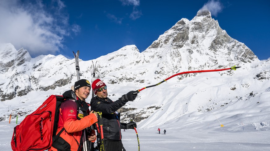 epa10975981 Jasmina Suter of Switzerland talks to Swiss-ski coach Ivano Nesa in front of the Matterhorn at the FIS Alpine Skiing World Cup event between Zermatt in Switzerland and Cervinia in Italy, 1 ...