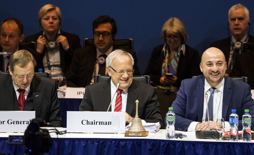 Swiss Federal President Johann Schneider-Ammann , center, and Etienne Schneider, Minister for Economy and Trade, of Luxembourg, right, attend the meeting of ESA Ministerial Council on Thursday, Dec. 1 ...