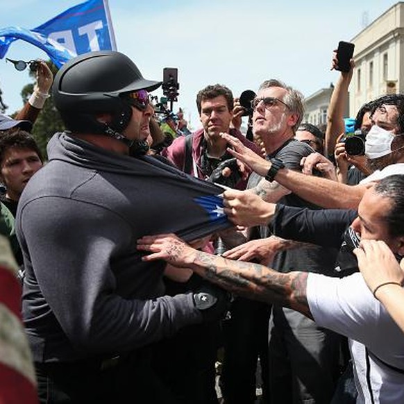 BERKELEY, CA - APRIL 15: Trump supporters clash with protesters at a &quot;Patriots Day&quot; free speech rally on April 15, 2017 in Berkeley, California. More than a dozen people were arrested after  ...