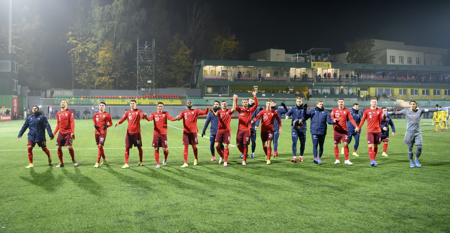 Switzerland players celebrate the victory after the 2022 FIFA World Cup European Qualifying Group C soccer match between Lithuania and Switzerland at LFF stadium in Vilnius, Lithuania, Tuesday, Octobe ...