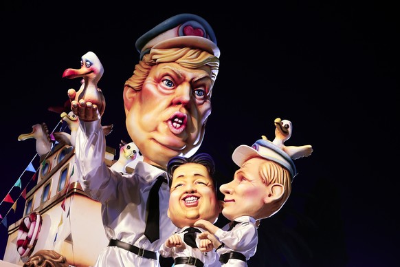 epa11899481 A float with figures depicting US President Donald J. Trump, North Korean leader Kim Jong Un and Russian President Vladimir Putin passes by the crowd during the 152nd annual Carnival of Ni ...