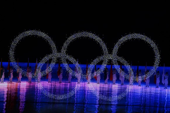 The Olympic rings illuminate during the closing ceremony of the 2022 Winter Olympics, Sunday, Feb. 20, 2022, in Beijing. (AP Photo/Brynn Anderson)