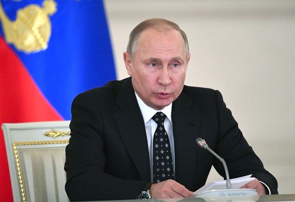 Russian President Vladimir Putin chairs a meeting of the State Council in the Kremlin, in Moscow, Russia, Wednesday, Dec. 27, 2017. (Alexander Nemenov/Pool Photo via AP)