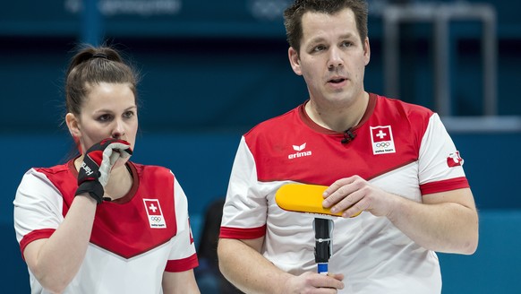 Jenny Perret of Switzerland and Martin Rios of Switzerland, from left, in action during the Mixed Doubles Curling round robin game between Switzerland and Finland one day prior to the opening of the X ...