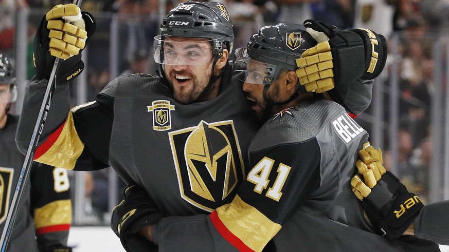 Vegas Golden Knights&#039; William Carrier, left, and Pierre-Edouard Bellemare celebrate after Bellemare scored against the Chicago Blackhawks during the second period of an NHL hockey game Tuesday, O ...