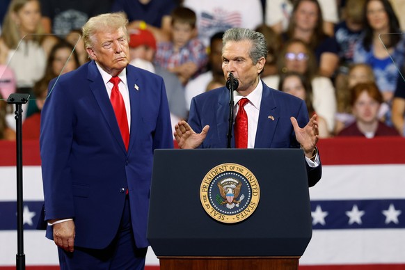 President Donald Trump looks on as Georgia Republican gubernatorial candidate Rick Jackson speaks during a rally at Wheeler High School in Marietta, Ga., Wednesday, July 22, 2026. (AP Photo/Erik S. Le ...