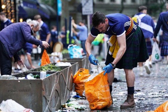 England v Scotland - UEFA EURO, EM, Europameisterschaft,Fussball 2020 - Group D - Wembley Stadium Scotland fans clean up litter in Irving Street near Leicester Square, London, ahead of the UEFA Euro 2 ...